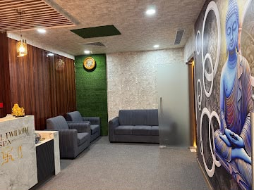 Reception lounge with Buddha mural at Eternal Twilight Spa